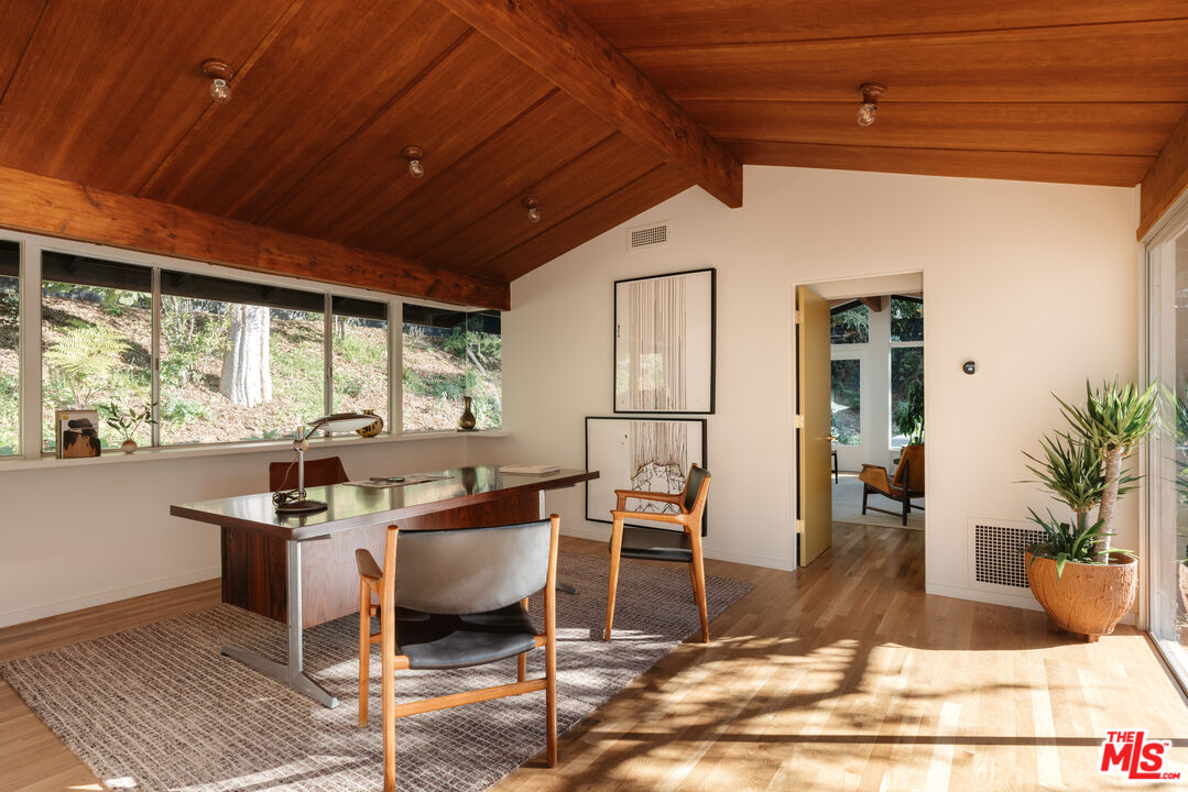 390 North San Rafael Avenue Pasadena, CA 91105 - Photo 27 of 39 a dining room with furniture a rug and wooden floor