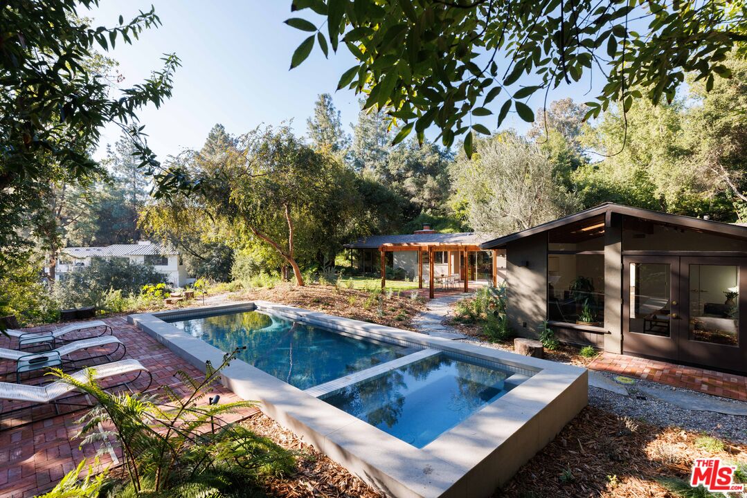 390 North San Rafael Avenue Pasadena, CA 91105 - Photo 32 of 39 a view of a house with pool and sitting area