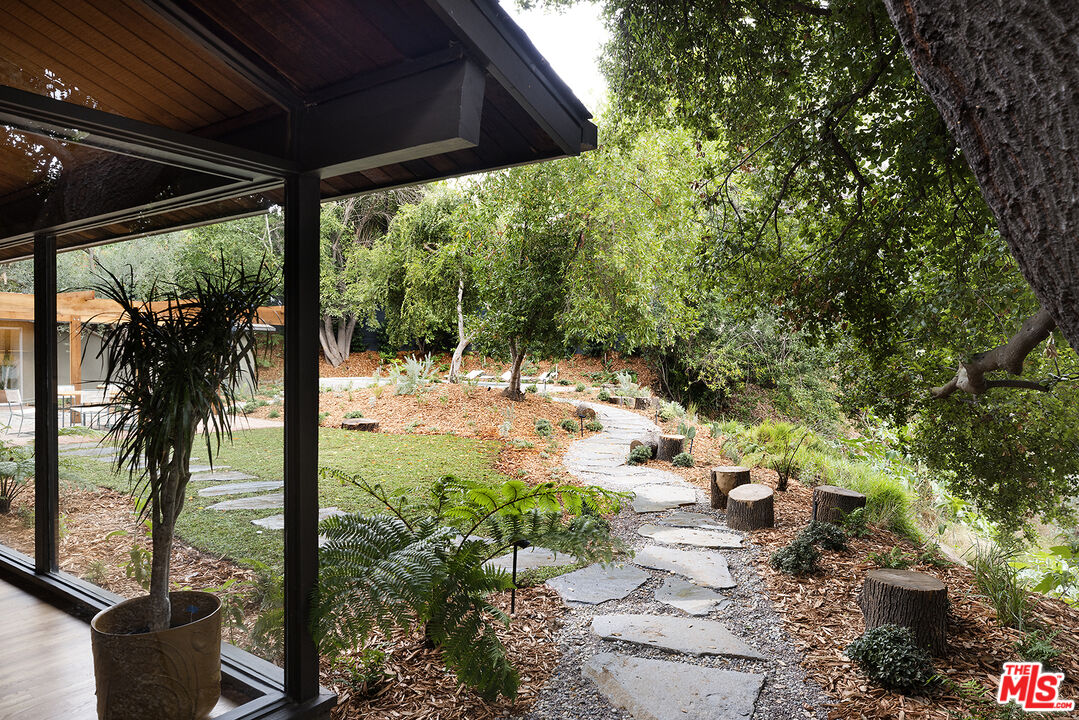 390 North San Rafael Avenue Pasadena, CA 91105 - Photo 34 of 39 a view of a porch with furniture and a backyard