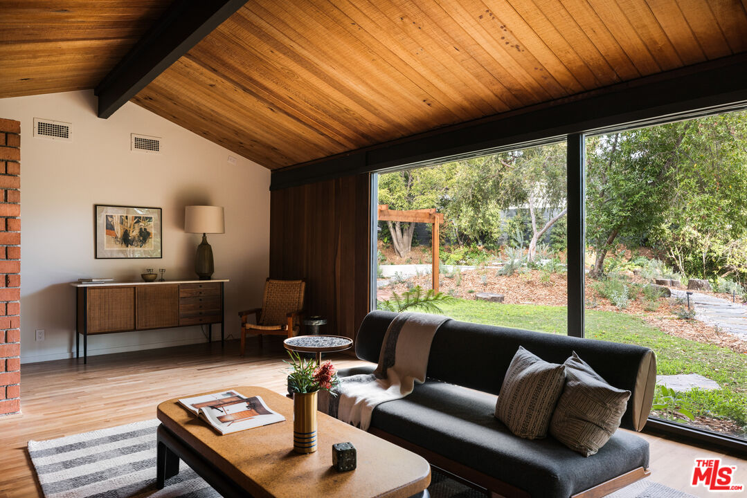 390 North San Rafael Avenue Pasadena, CA 91105 - Photo 4 of 39 a living room with furniture and a large window