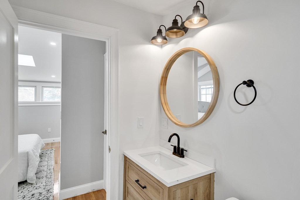 39 Abbott Road Waltham, MA 02452 - Photo 12 of 18 a bathroom with a sink and a mirror