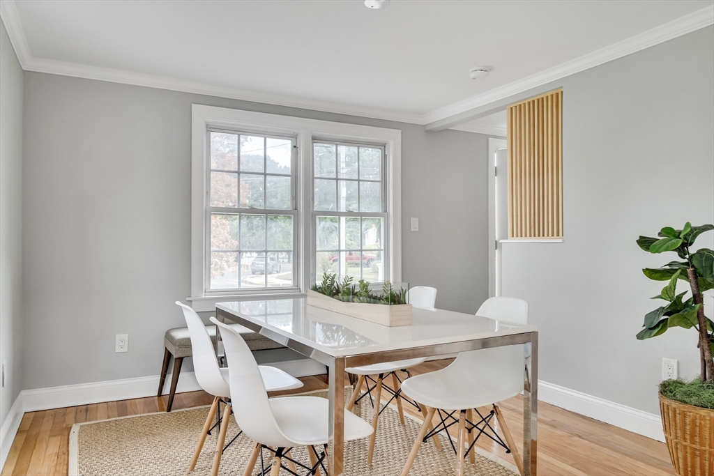 39 Abbott Road Waltham, MA 02452 - Photo 7 of 18 a view of a dining room with furniture and wooden floor