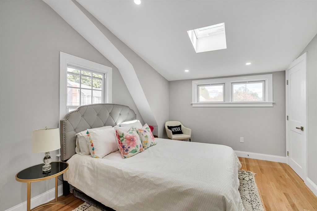 39 Abbott Road Waltham, MA 02452 - Photo 8 of 18 a bedroom with a bed and a window