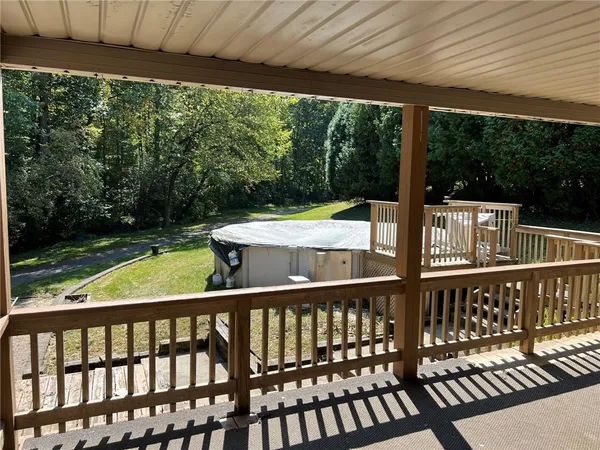 a view of a two chairs in the deck