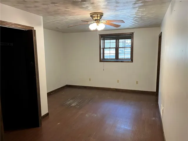 a view of an empty room with windows