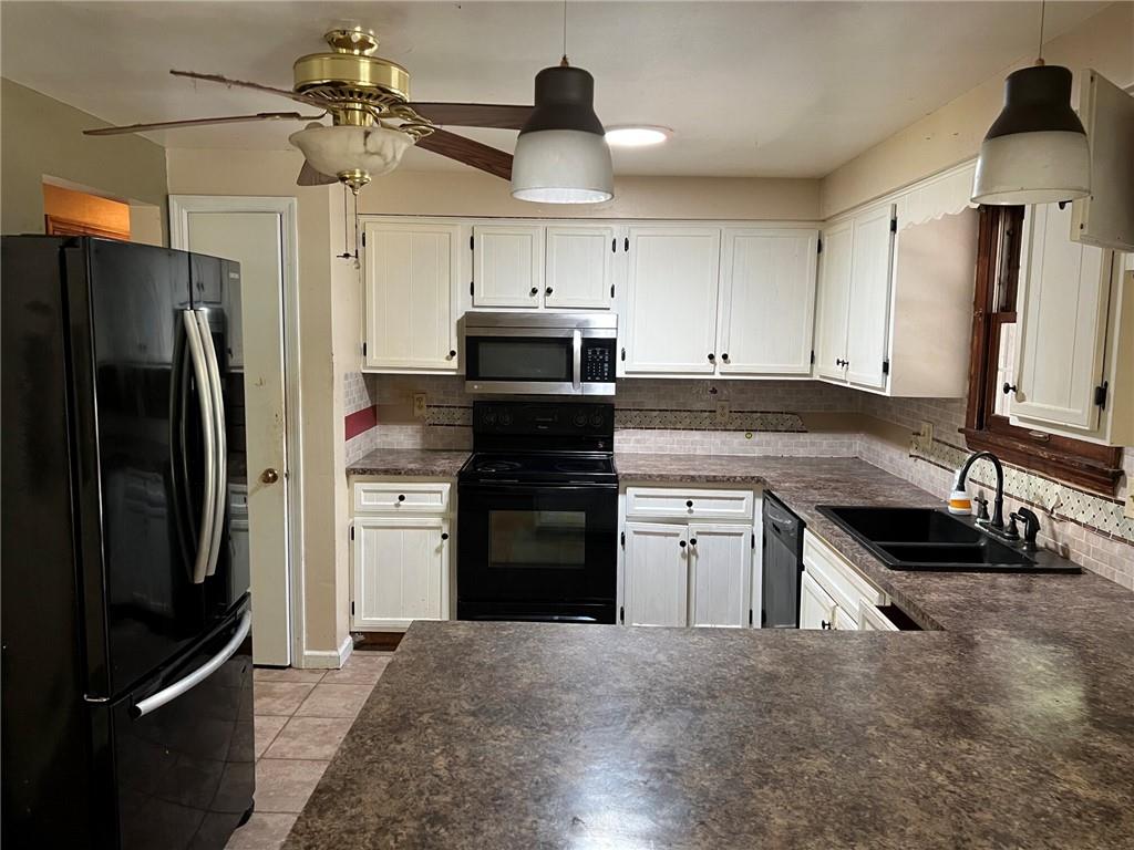 470 Donohoe Road Greensburg, PA 15601 - Photo 5 of 31 a kitchen with a refrigerator stove and sink