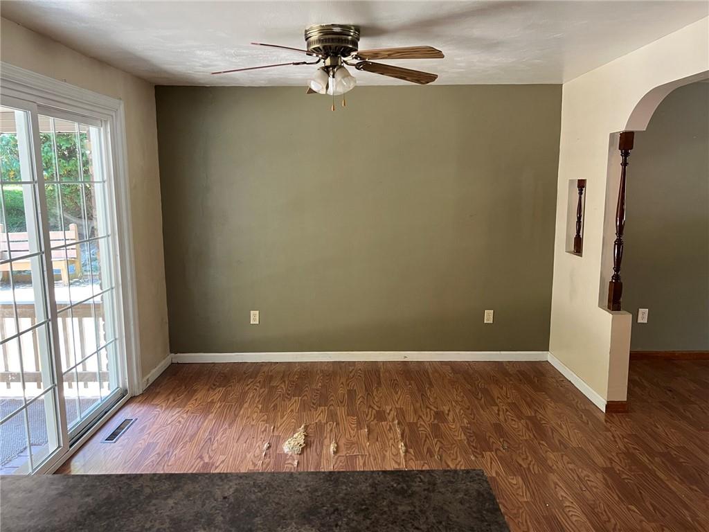 470 Donohoe Road Greensburg, PA 15601 - Photo 6 of 31 an empty room with wooden floor and windows