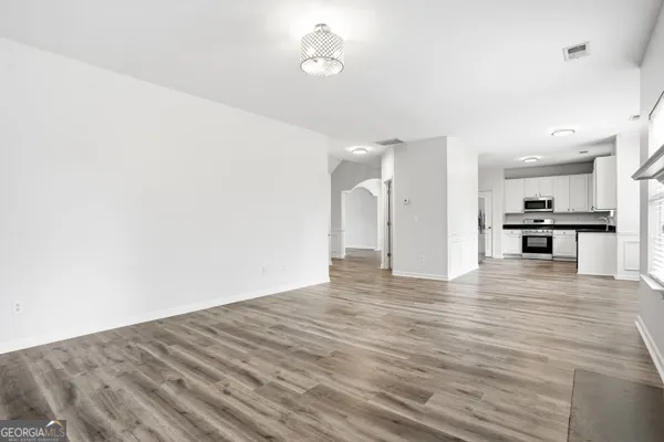 a view of kitchen with wooden floor