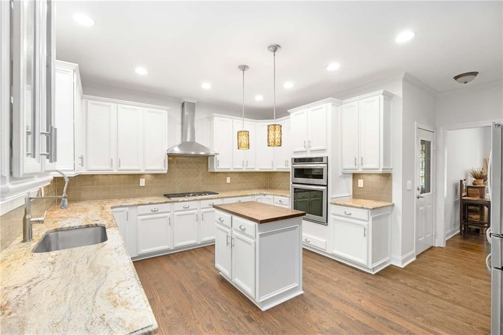 4200 Cherry Grove Road Ball Ground, GA 30107 - Photo 15 of 64 a kitchen with a stove sink and cabinets
