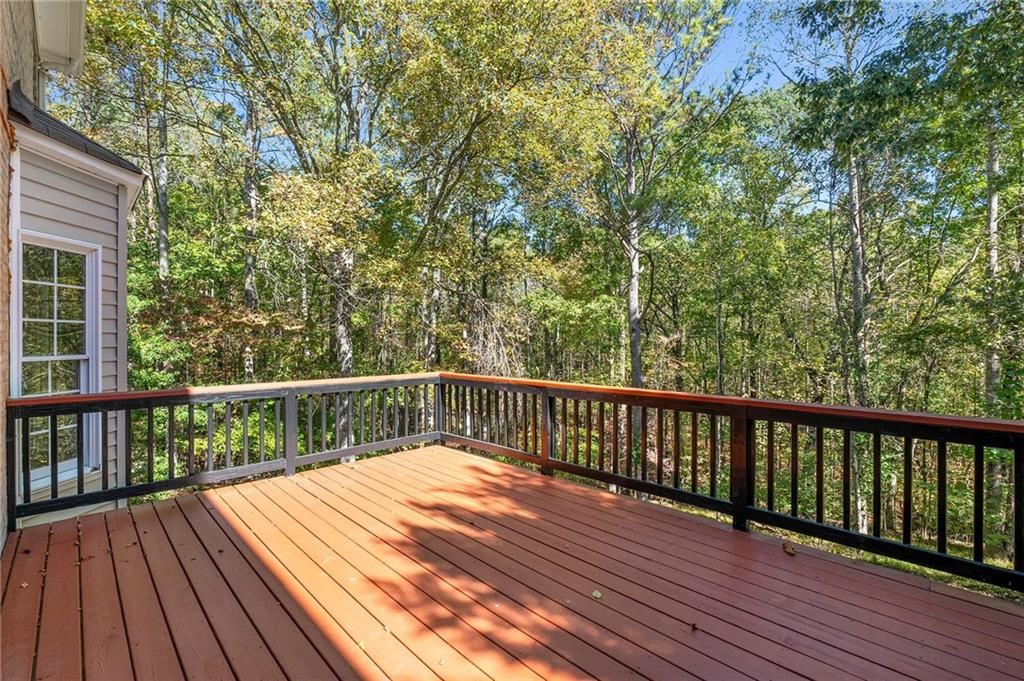 4200 Cherry Grove Road Ball Ground, GA 30107 - Photo 20 of 64 a balcony with wooden floor and fence