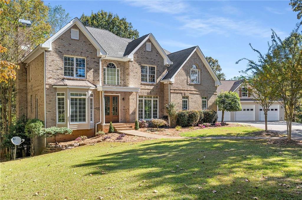 4200 Cherry Grove Road Ball Ground, GA 30107 - Photo 2 of 64 a front view of a house with a yard