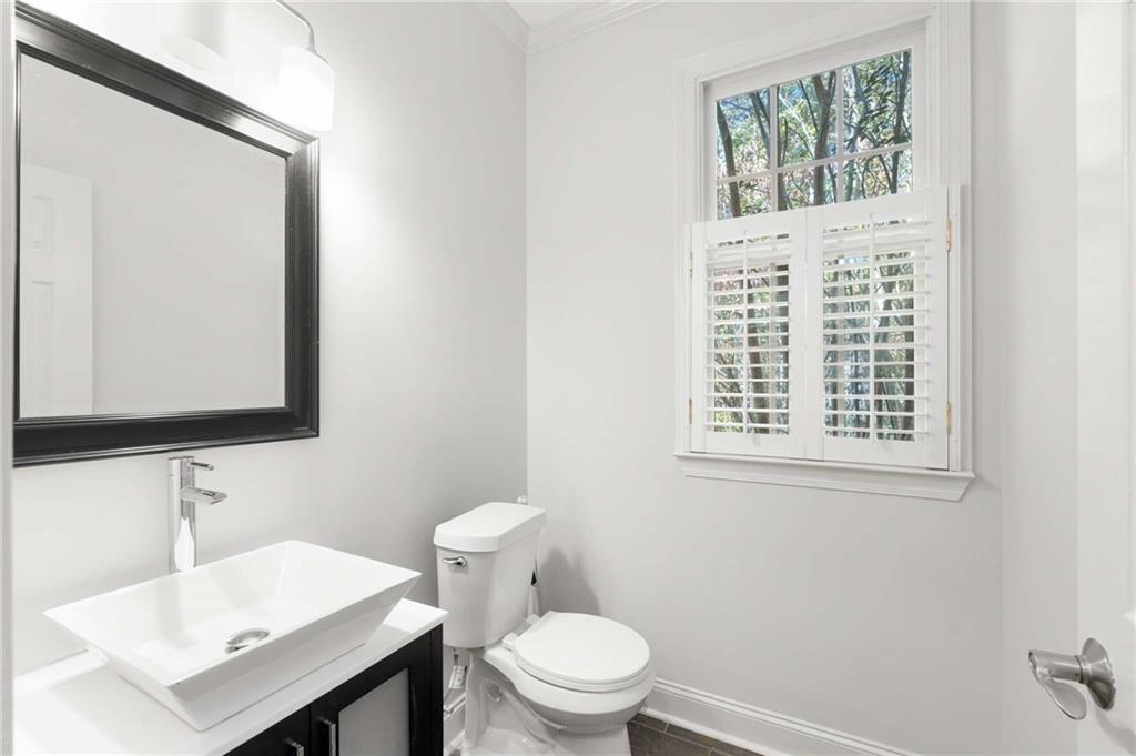 4200 Cherry Grove Road Ball Ground, GA 30107 - Photo 24 of 64 a bathroom with a sink a toilet and a mirror