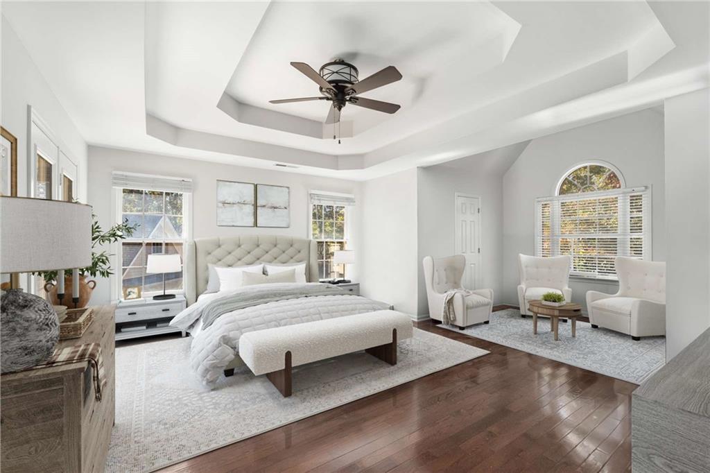 4200 Cherry Grove Road Ball Ground, GA 30107 - Photo 27 of 64 a bedroom with a bed and wooden floor