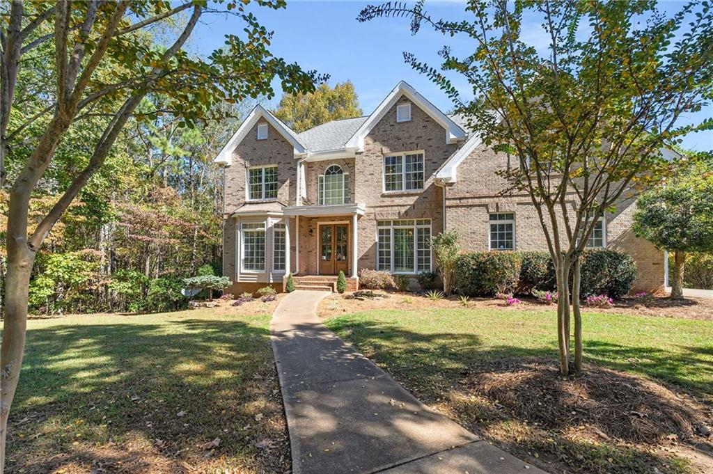 4200 Cherry Grove Road Ball Ground, GA 30107 - Photo 3 of 64 a front view of a house with a yard