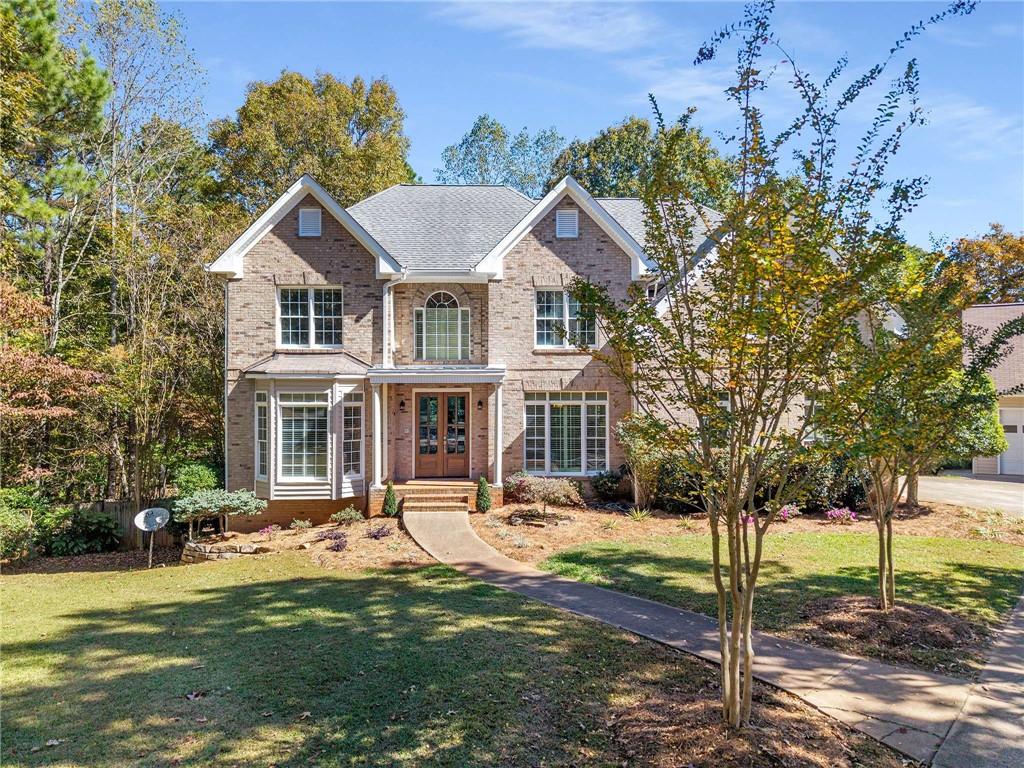 4200 Cherry Grove Road Ball Ground, GA 30107 - Photo 4 of 64 a front view of a house with a yard