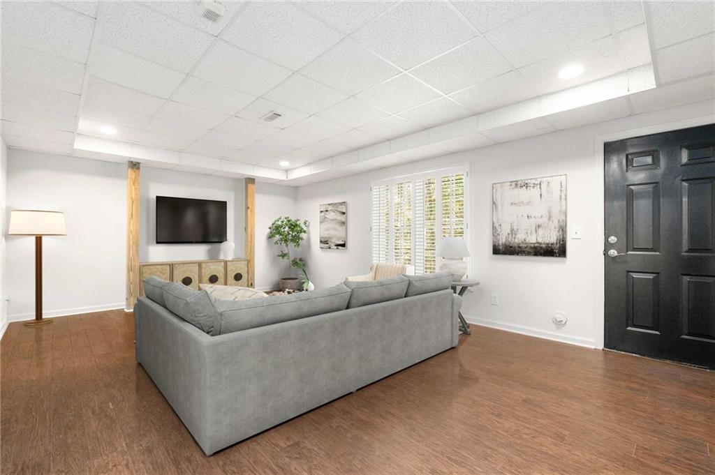 4200 Cherry Grove Road Ball Ground, GA 30107 - Photo 42 of 64 a living room with furniture and a flat screen tv