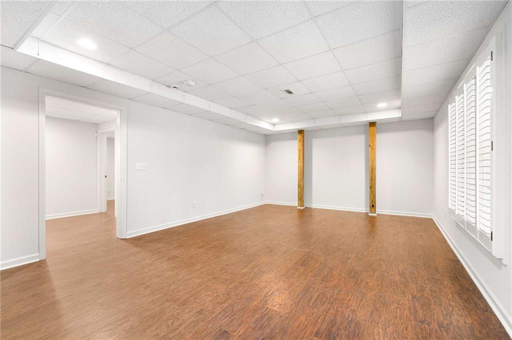 4200 Cherry Grove Road Ball Ground, GA 30107 - Photo 45 of 64 wooden floor in an empty room with a window