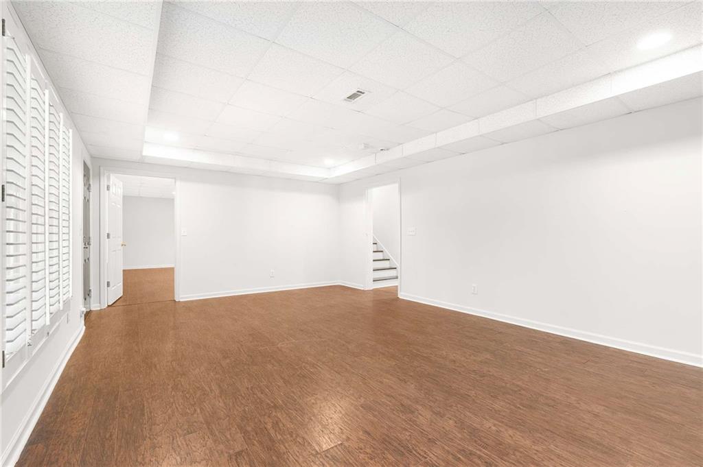 4200 Cherry Grove Road Ball Ground, GA 30107 - Photo 47 of 64 a view of an empty room with wooden floor