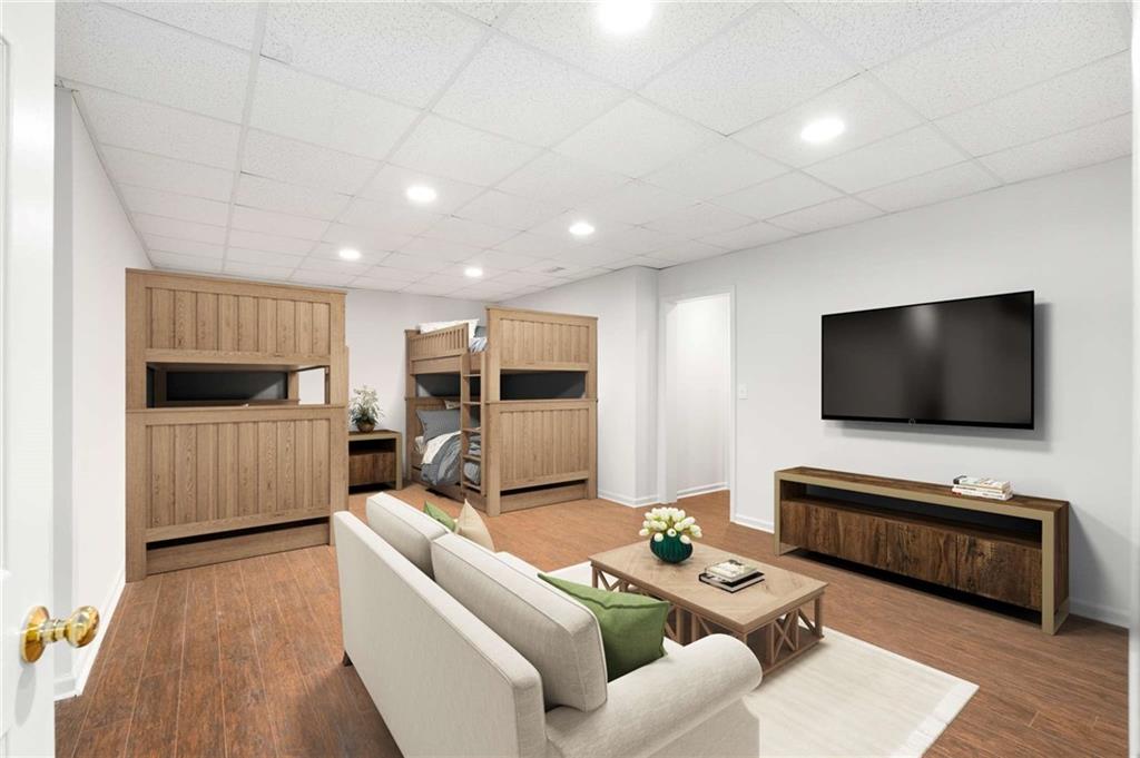 4200 Cherry Grove Road Ball Ground, GA 30107 - Photo 48 of 64 a living room with furniture and a flat screen tv