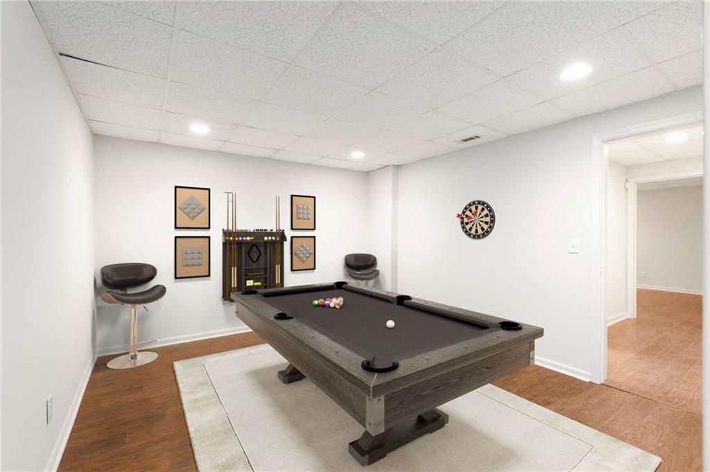 4200 Cherry Grove Road Ball Ground, GA 30107 - Photo 50 of 64 a living room with a couch coffee table and a fireplace