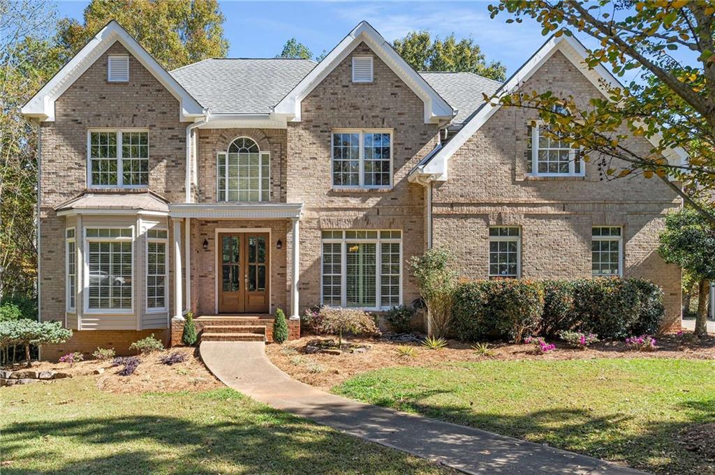 4200 Cherry Grove Road Ball Ground, GA 30107 - Photo 5 of 64 a view of a house with yard and sitting area