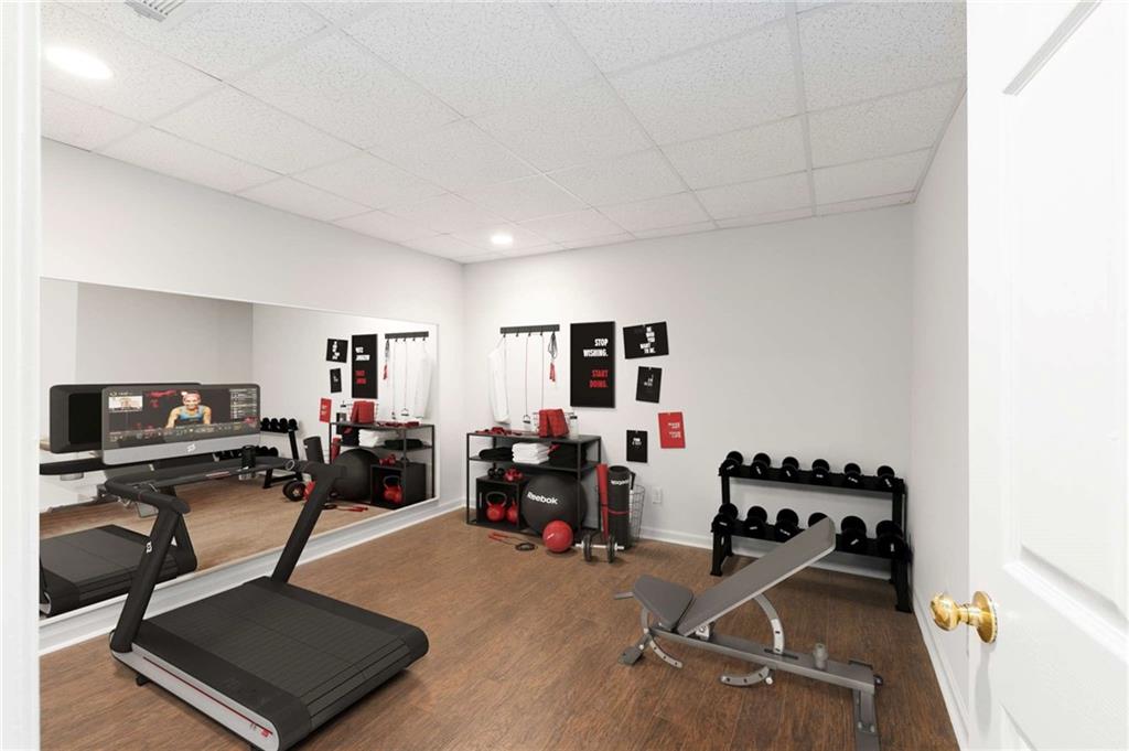 4200 Cherry Grove Road Ball Ground, GA 30107 - Photo 52 of 64 a room with gym equipment and a window