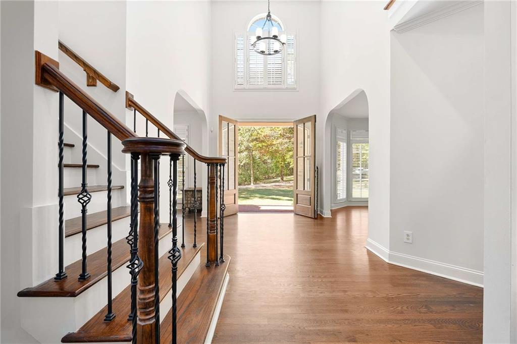 4200 Cherry Grove Road Ball Ground, GA 30107 - Photo 6 of 64 a view of a hallway with wooden floor and windows