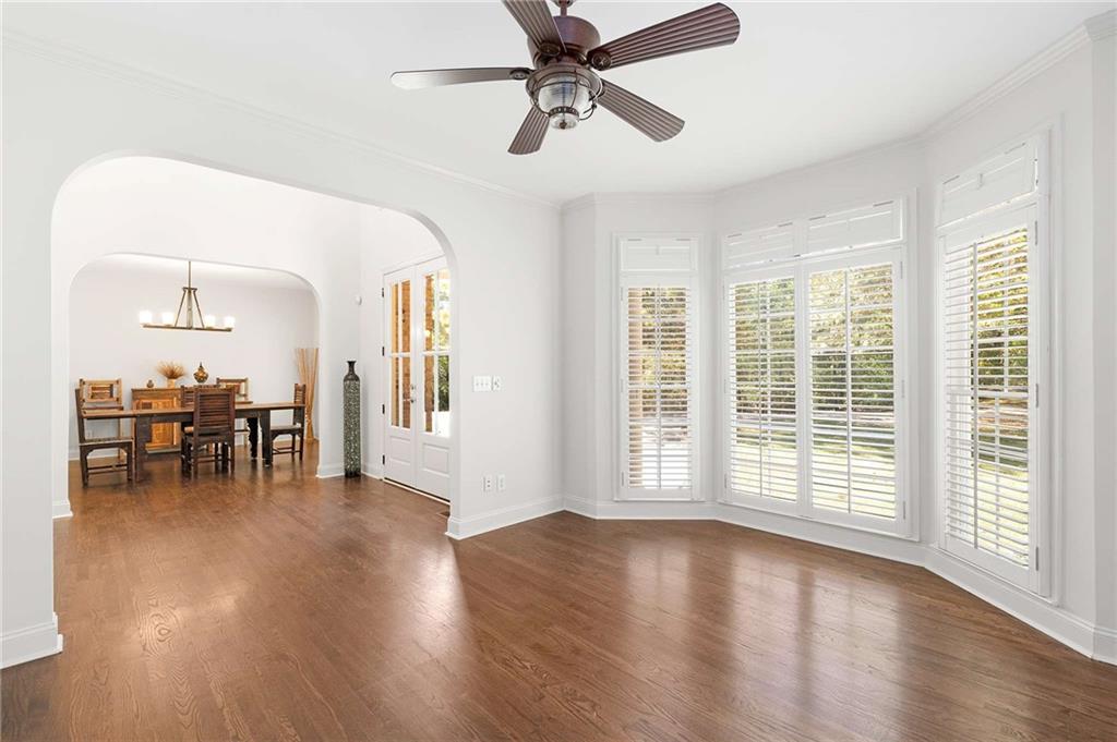 4200 Cherry Grove Road Ball Ground, GA 30107 - Photo 8 of 64 a view of empty room with wooden floor and fan