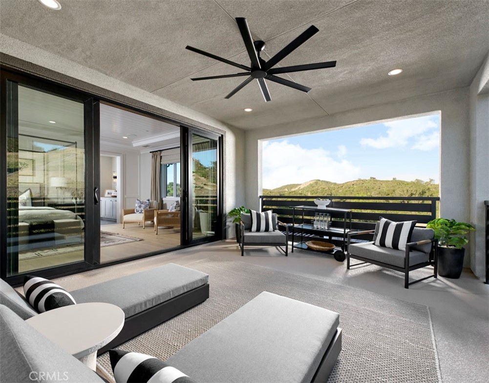 18295 Saddle Crest Silverado, CA 92676 - Photo 16 of 26 a living room with furniture ceiling fan and a large window