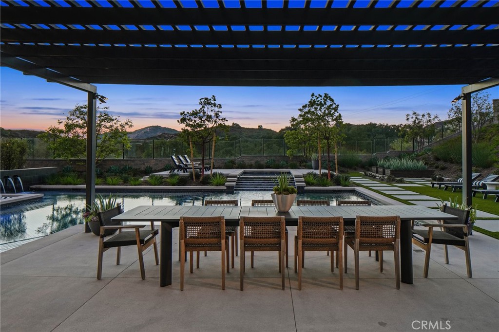 18295 Saddle Crest Silverado, CA 92676 - Photo 24 of 26 a view of a patio with chairs and table of a patio