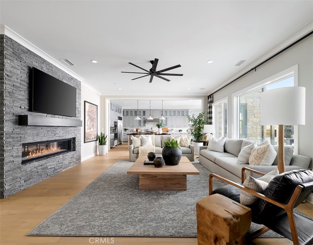 18295 Saddle Crest Silverado, CA 92676 - Photo 5 of 26 a living room with furniture a fireplace and a flat screen tv