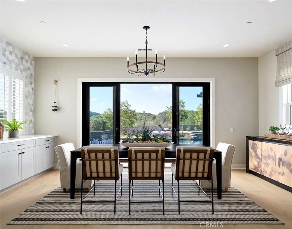 18295 Saddle Crest Silverado, CA 92676 - Photo 10 of 26 a view of a dining room with furniture window and wooden floor