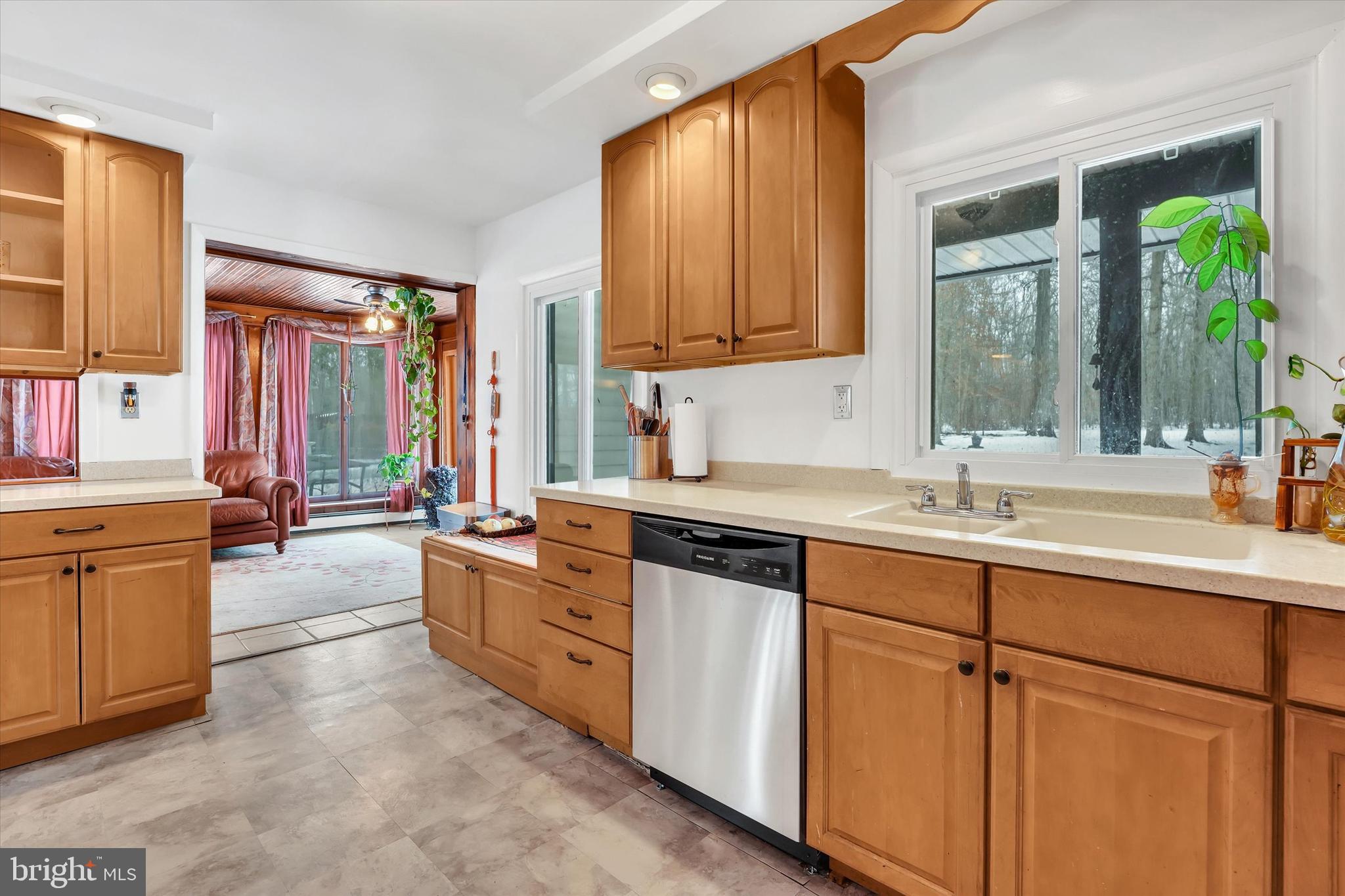 6246 Point Pleasant Pike Doylestown, PA 18902 - Photo 11 of 40 a room with kitchen island granite countertop a sink stainless steel appliances and cabinets