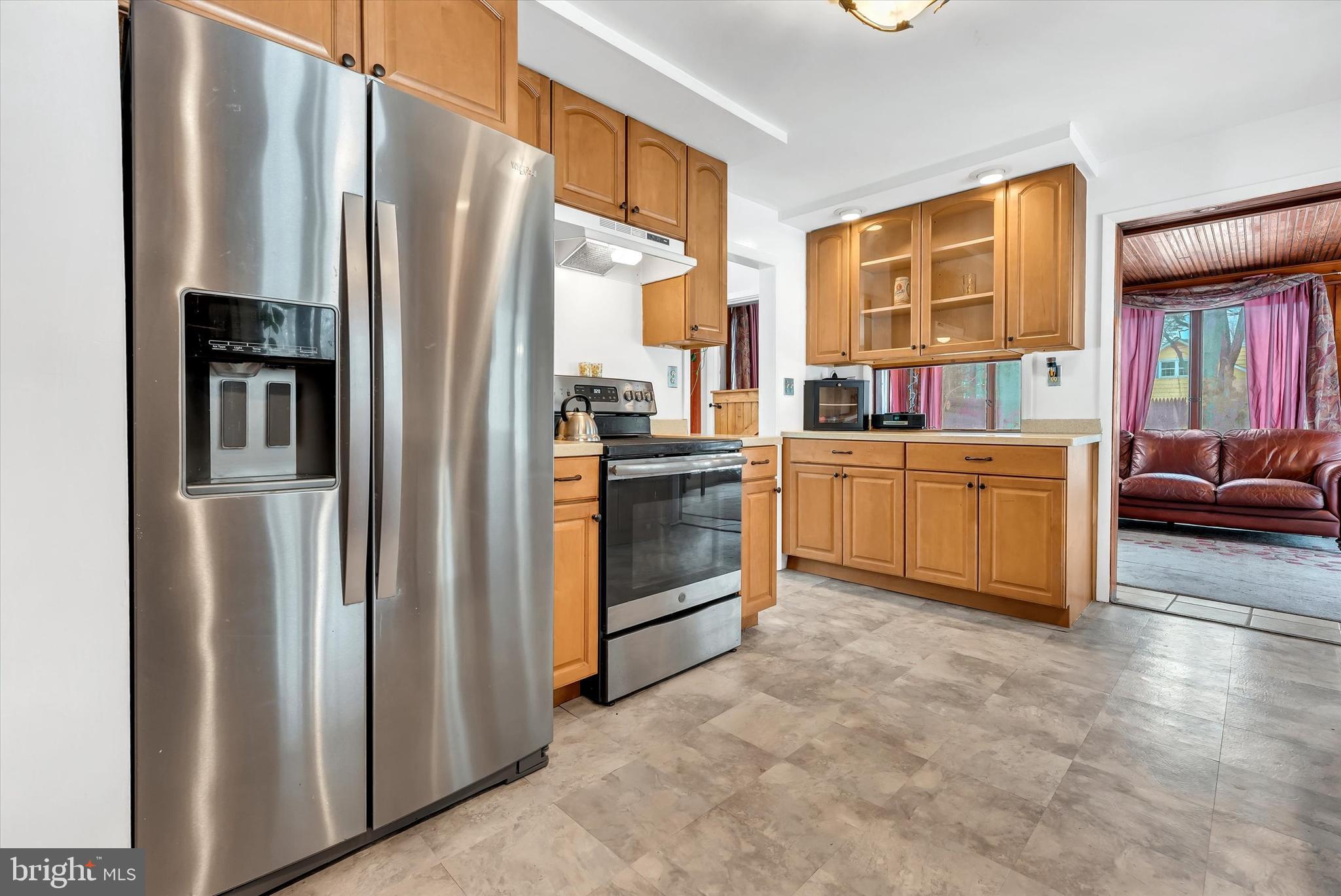 6246 Point Pleasant Pike Doylestown, PA 18902 - Photo 12 of 40 a kitchen with stainless steel appliances a refrigerator and a stove