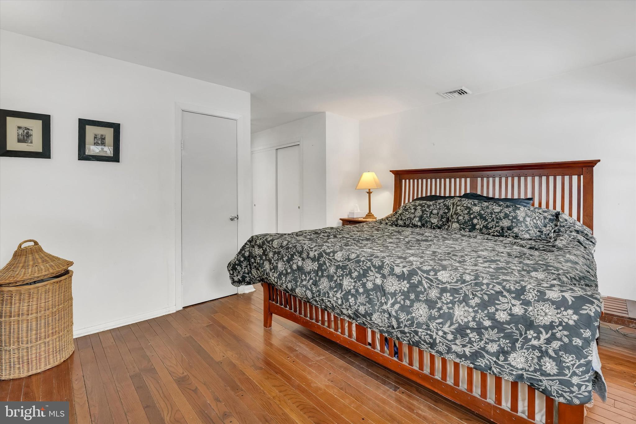 6246 Point Pleasant Pike Doylestown, PA 18902 - Photo 15 of 40 a large bed sitting in a bedroom next to a cabinet