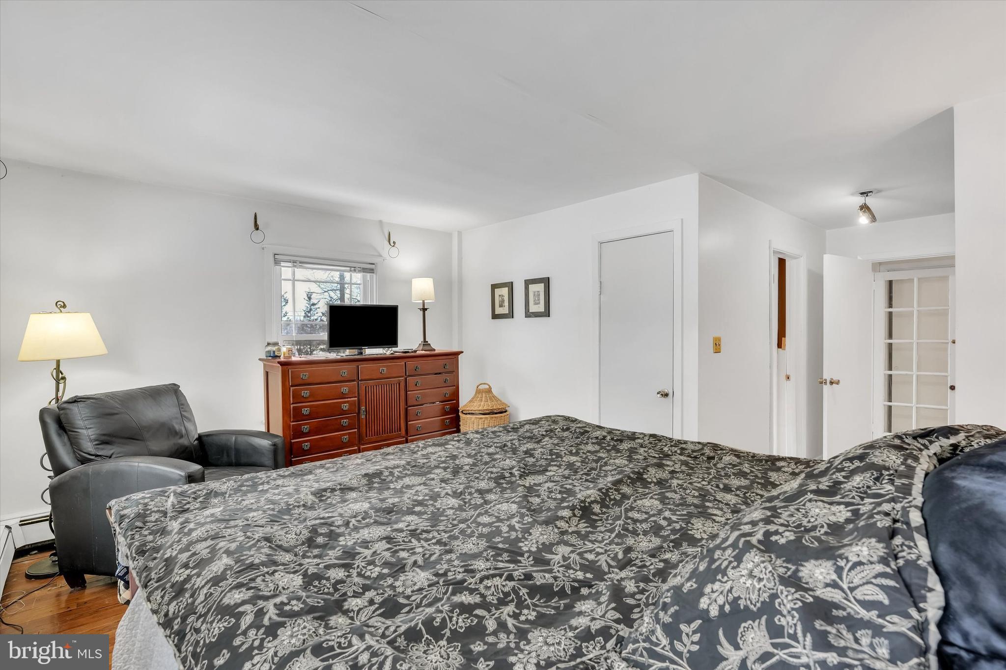6246 Point Pleasant Pike Doylestown, PA 18902 - Photo 16 of 40 a bedroom with a bed and a flat screen tv