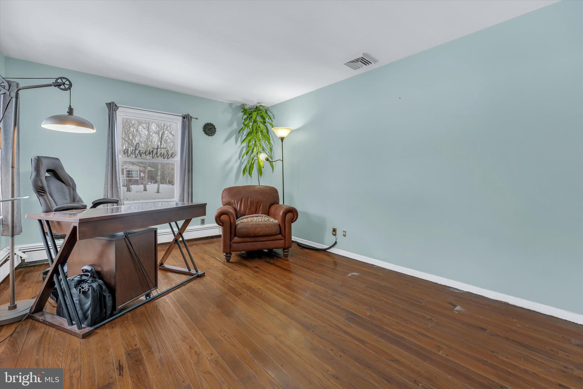 6246 Point Pleasant Pike Doylestown, PA 18902 - Photo 19 of 40 a living room with furniture and a potted plant