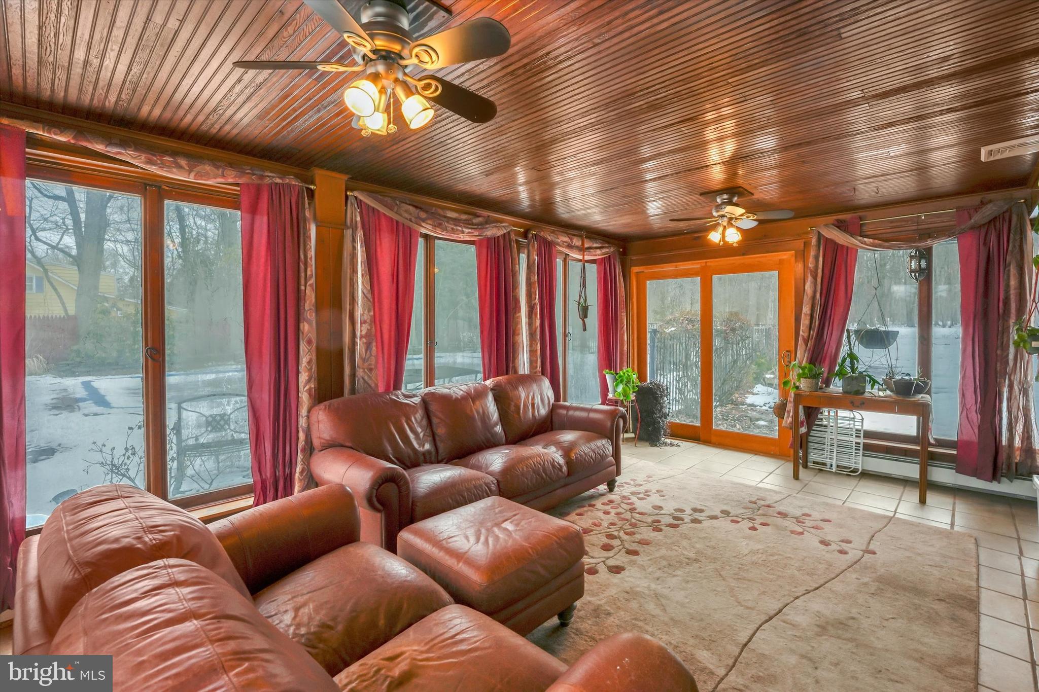 6246 Point Pleasant Pike Doylestown, PA 18902 - Photo 25 of 40 a living room with furniture and a large window