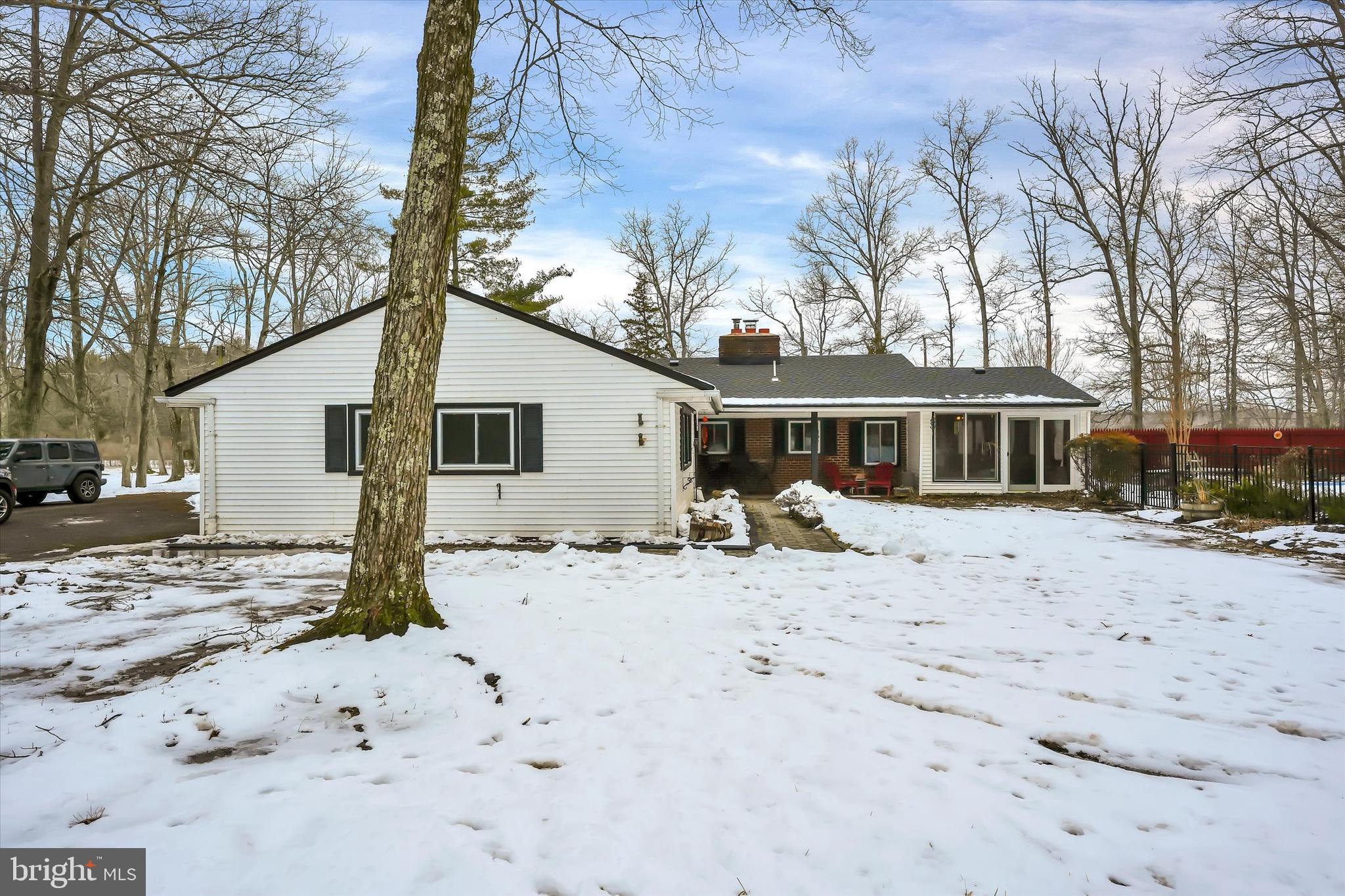 6246 Point Pleasant Pike Doylestown, PA 18902 - Photo 28 of 40 a view of a house with a yard covered in snow