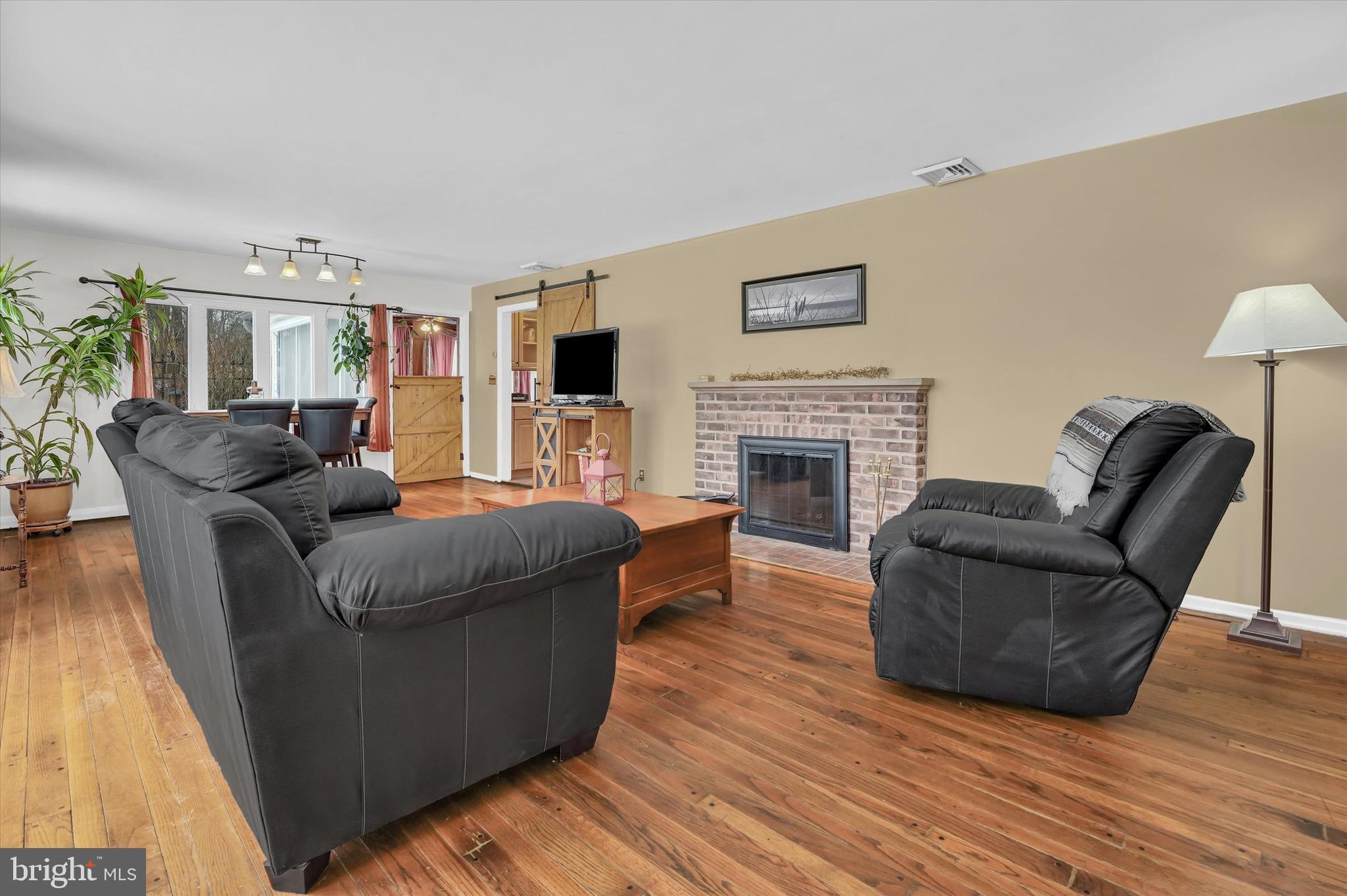 6246 Point Pleasant Pike Doylestown, PA 18902 - Photo 4 of 40 a living room with furniture and a fireplace