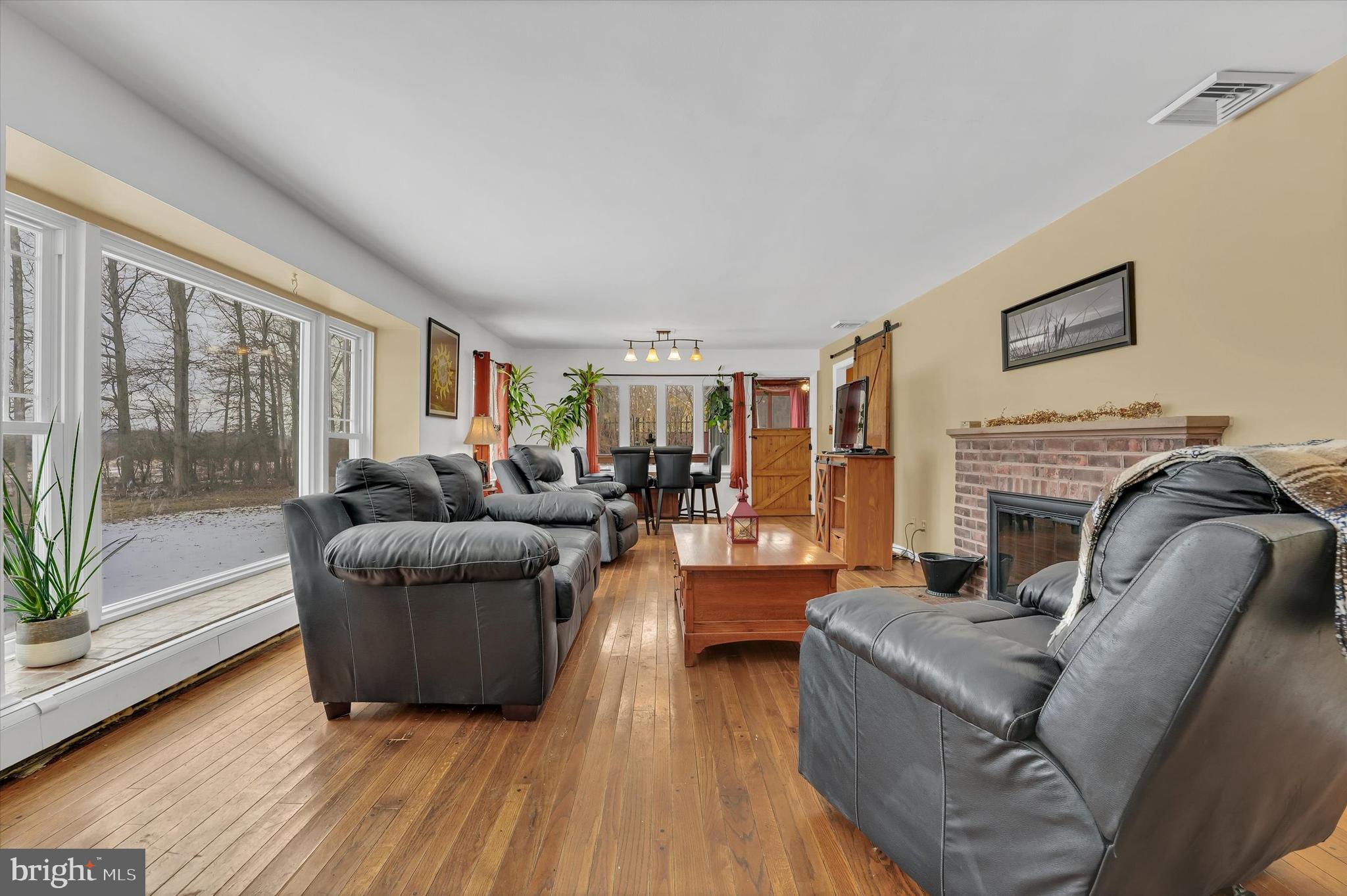 6246 Point Pleasant Pike Doylestown, PA 18902 - Photo 5 of 40 a living room with furniture and a fireplace