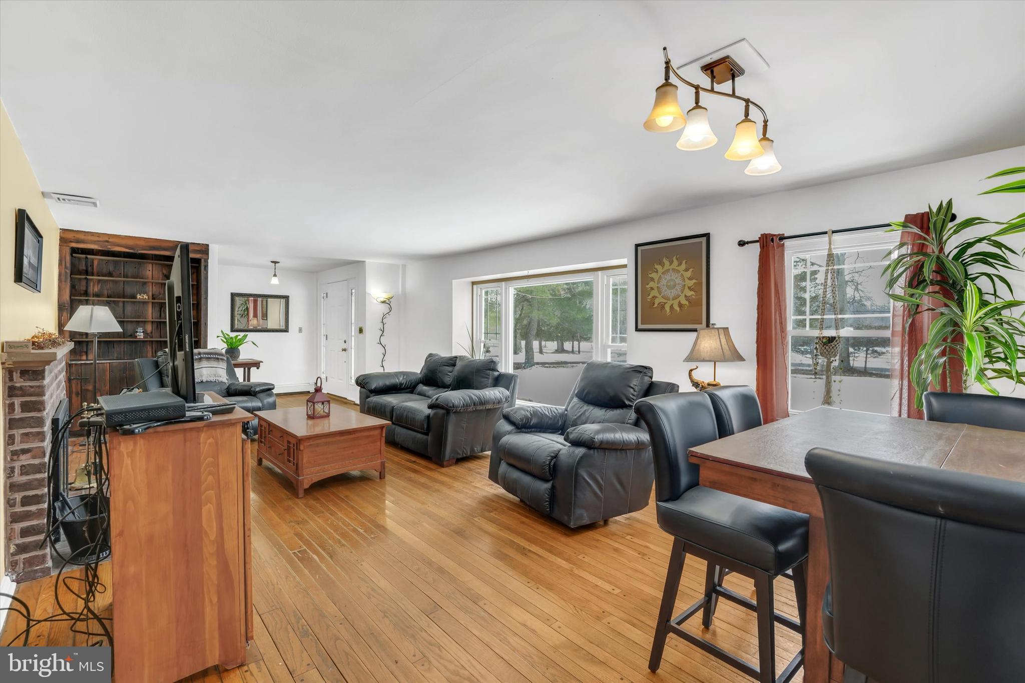 6246 Point Pleasant Pike Doylestown, PA 18902 - Photo 8 of 40 a living room with furniture and a flat screen tv