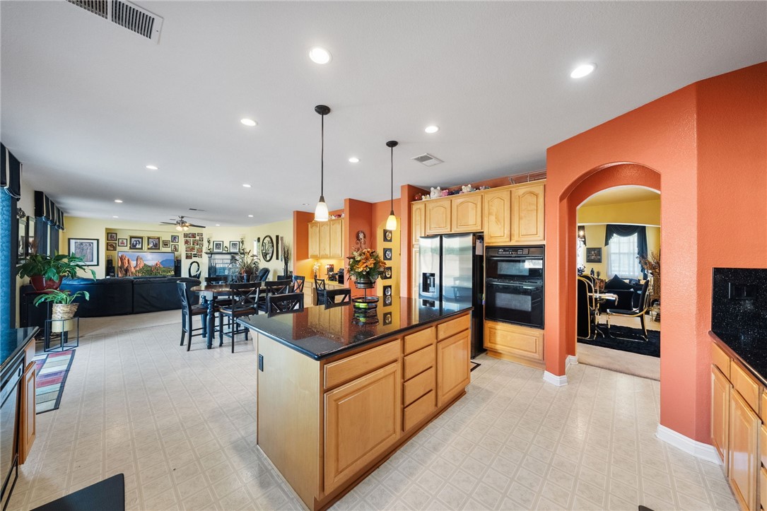 6920 Channel Court Eastvale, CA 91752 - Photo 17 of 57 a view of a living room and kitchen