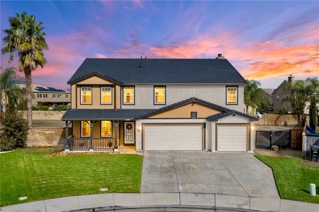 6920 Channel Court Eastvale, CA 91752 - Photo 2 of 57 a front view of a house with garden