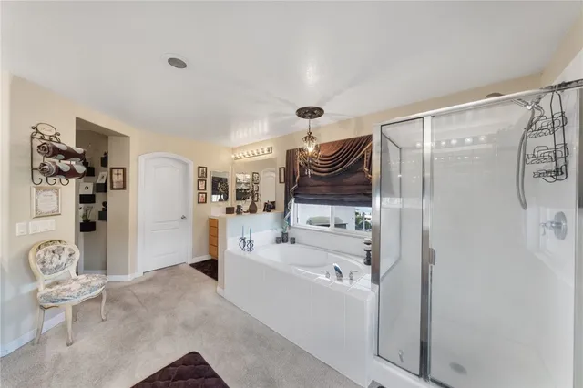 a bathroom with a bathtub sink and shower