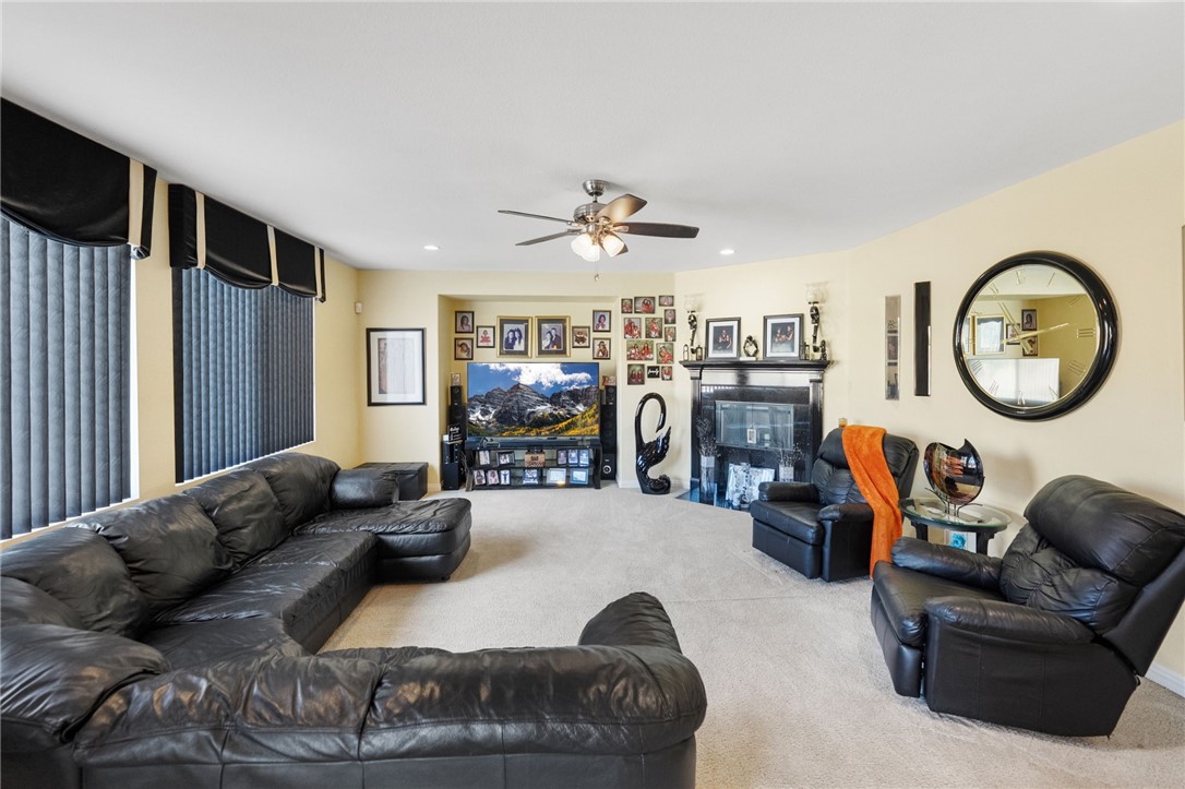 6920 Channel Court Eastvale, CA 91752 - Photo 22 of 57 a living room with furniture and a large window