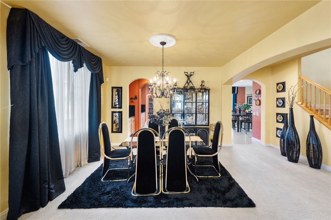 6920 Channel Court Eastvale, CA 91752 - Photo 34 of 57 a dining room with furniture and window
