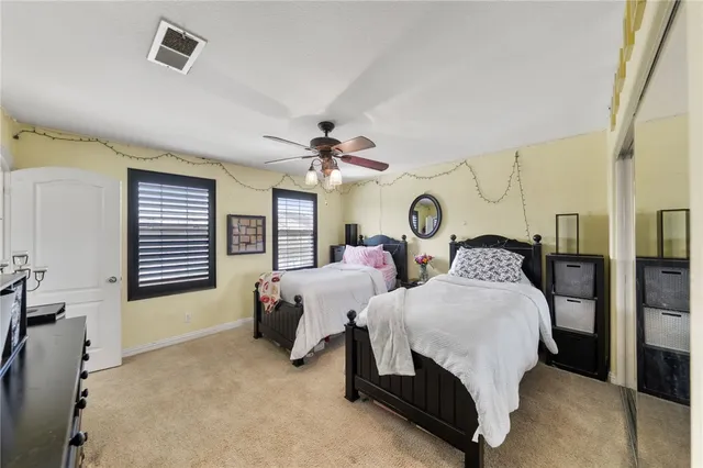 a large white kitchen with a large window
