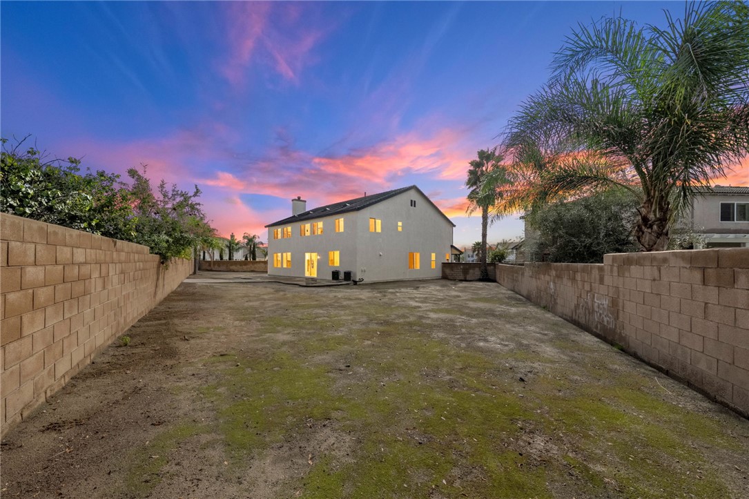 6920 Channel Court Eastvale, CA 91752 - Photo 4 of 57 a view of a house with wooden fence