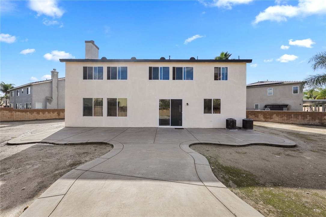 6920 Channel Court Eastvale, CA 91752 - Photo 45 of 57 a large white house with a large windows